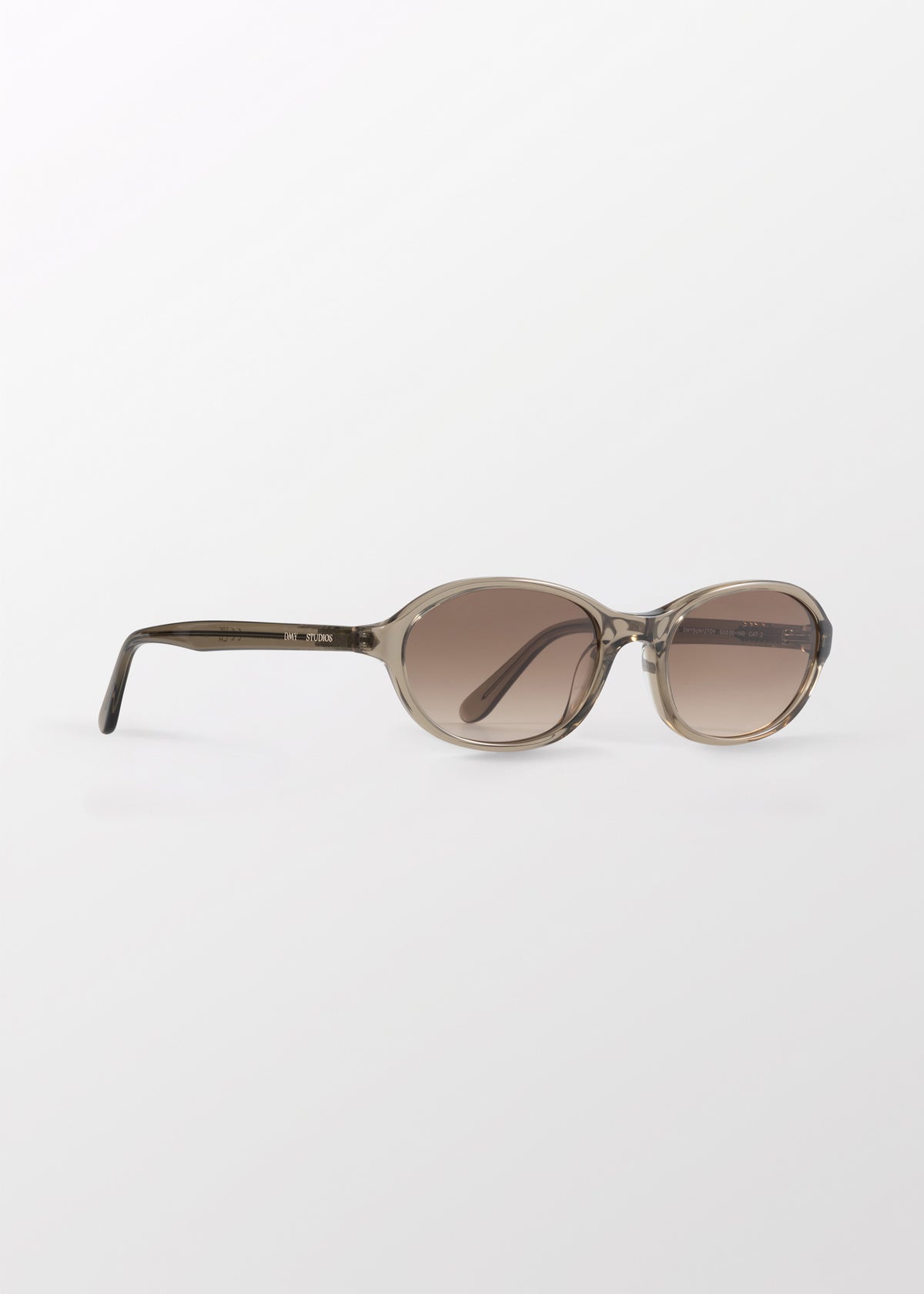 Bibi Oyster Sunglasses by DMY Studios with brown tinted lenses.