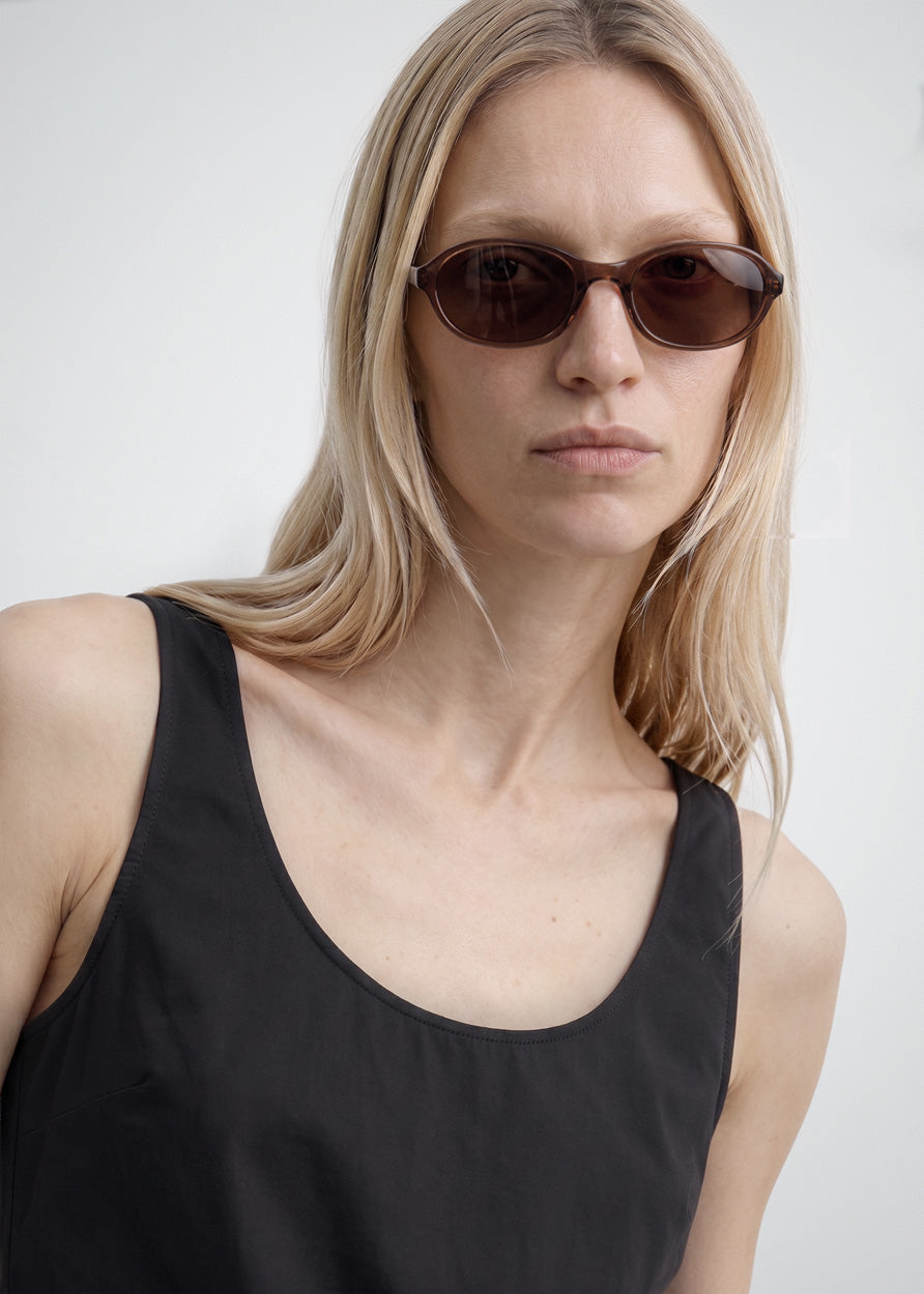 A model wearing Bibi Brown sunglasses by DMY Studios.